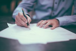 desk-writing-work-hand-man-table-person-people-boy-pen-notepad-male-sign-young